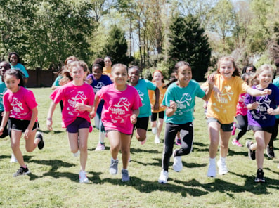 Girls on the Run participant smiles outdoors 